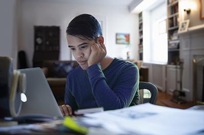 male-student-studying-laptop